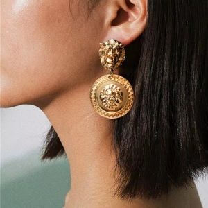 Gold lion head earrings